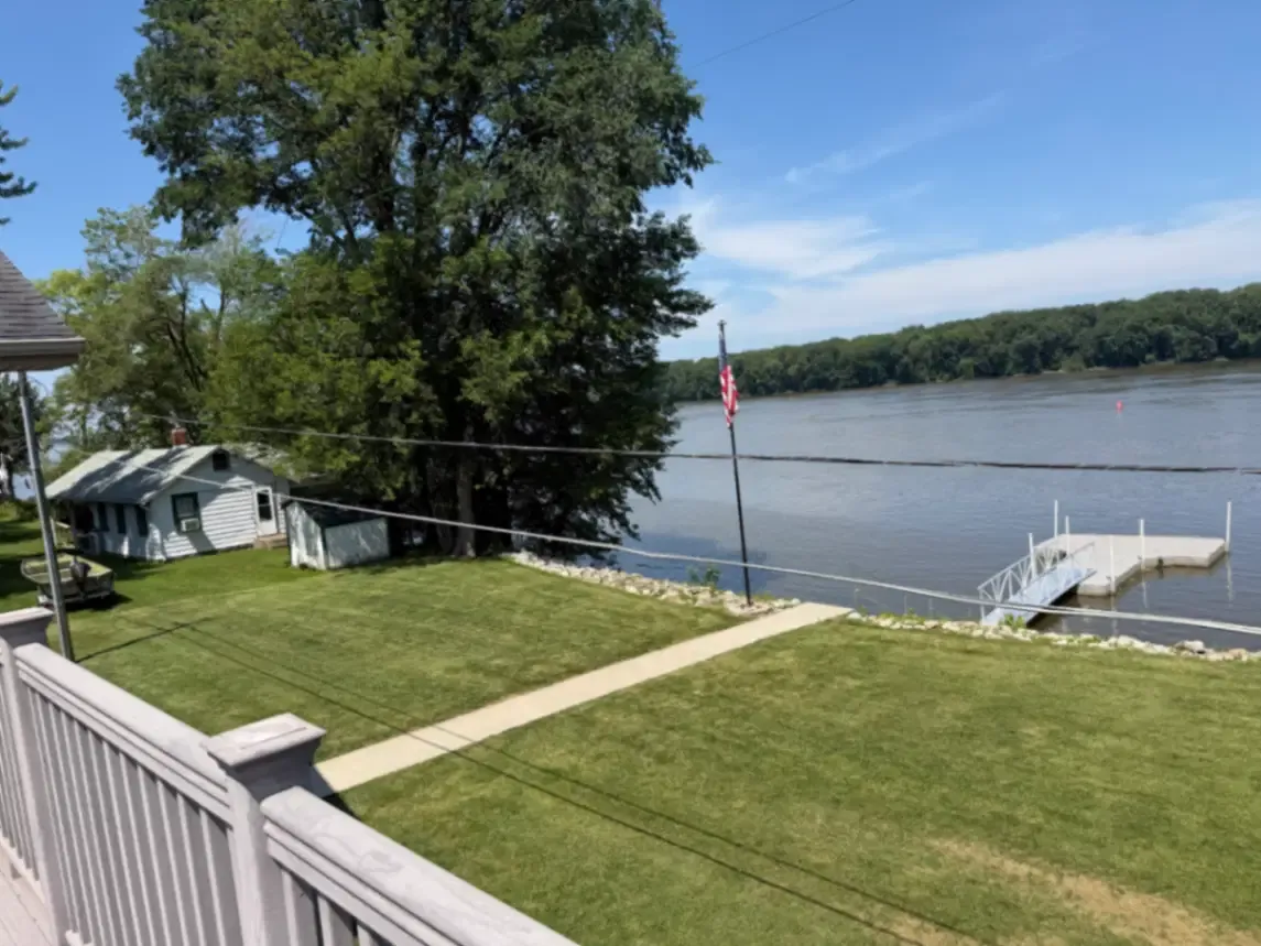 Lawn mowing service with clean stripes at a property in Thomson, Illinois